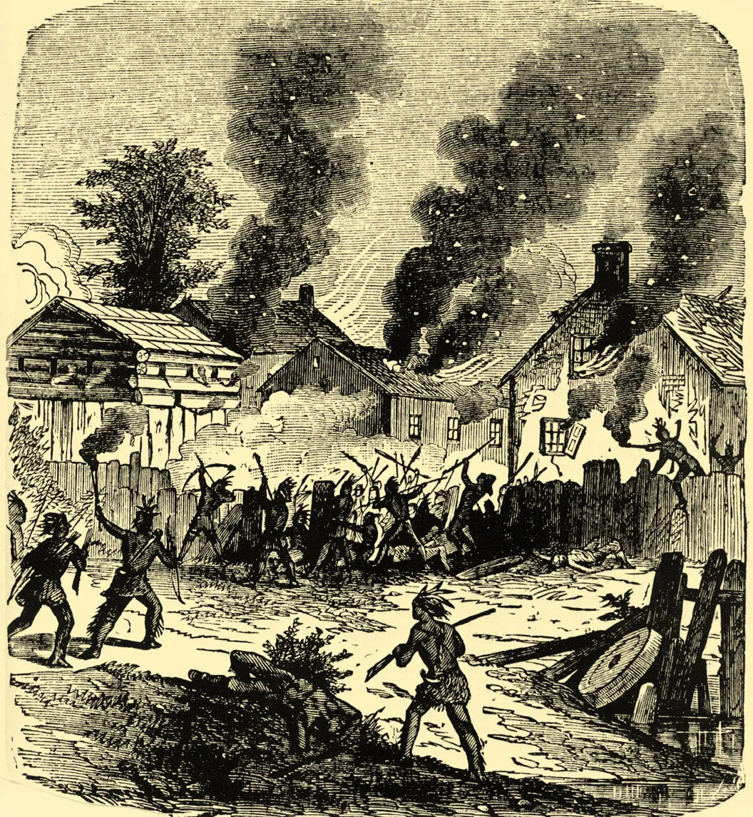 A black and white drawing of several two-storied houses on fire. Several people stand on the other side of a tall fence, closest to the viewer, and shoot arrows over the fence or hold up muskets.