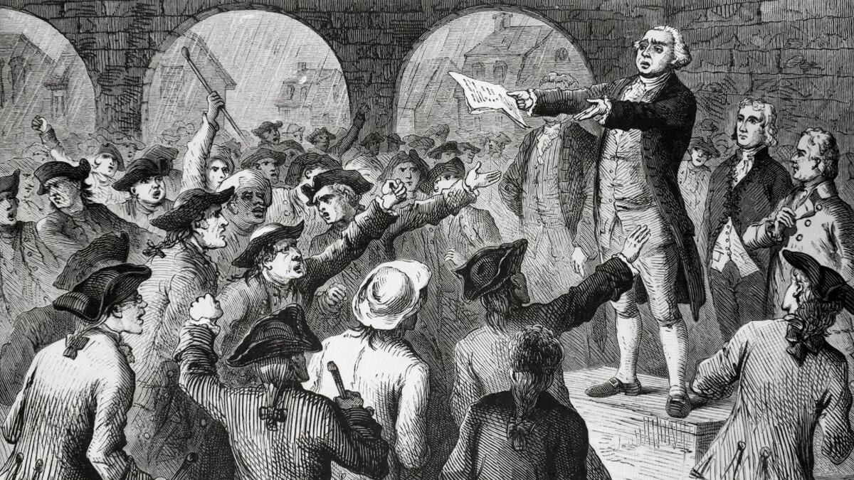 A black and white drawing of a group of men in long coats and tri-corner hats looking at a man standing on a raised platform. The man on the platform has his arms raised out towards the group of men and a document in his left hand. He wears a long coat, a vest, knee-length pants, and shoes with large buckles. The group of men below him gesture angerly towards him.