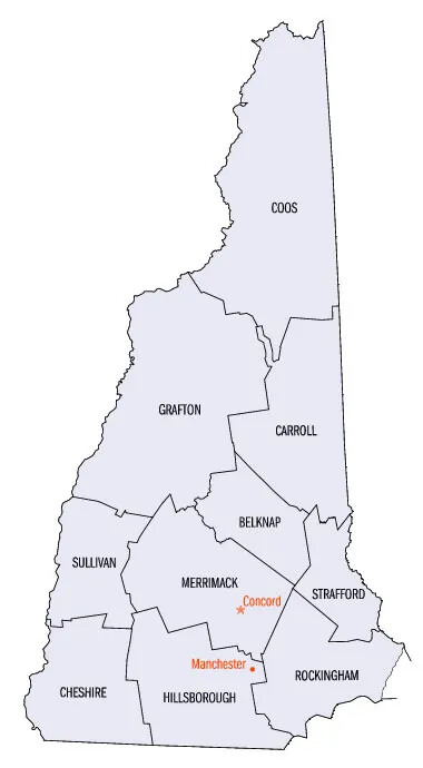 A gray map of New Hampshire, sectioned off into the state’s different sized counties. Each county is labeled in black text, and reads, from left to right, “CHESHIRE/HILLSBOROUGH/ROCKINGHAM/SULLIVAN/MERRIMACK/STRAFFORD/GRAFTON/CARROLL/COOS”. Inside the Merrimack and Hillsborough counties, the cities of Concord and Manchester are labeled in red text.