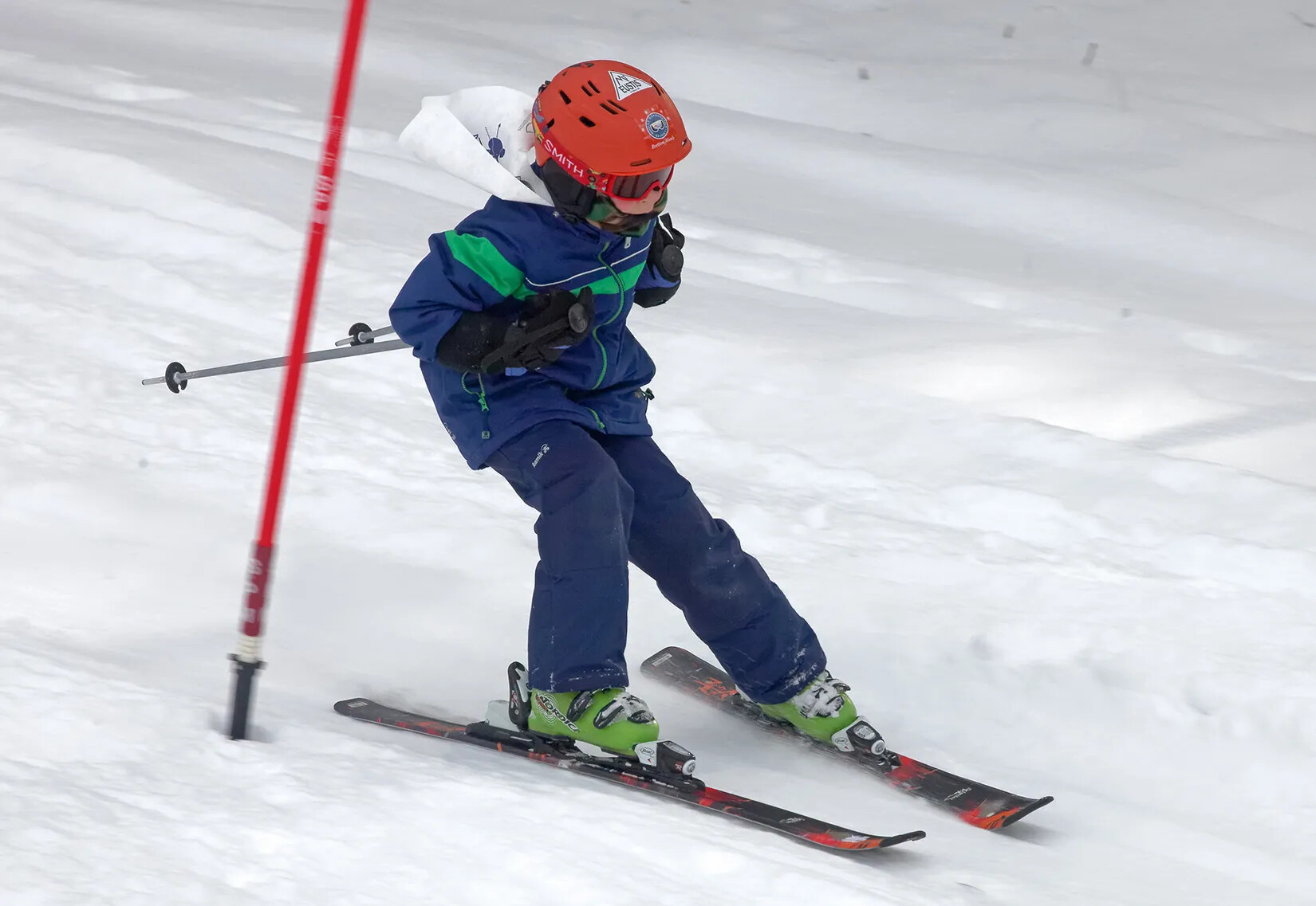 child is skiing down a mountain. 