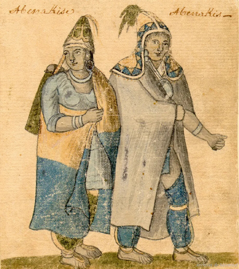 A colored drawing of two people standing next to each other. The person on the left wears a blue shirt, green pants, a yellow and blue cape, and a brown cone-shaped hat. The person on the right wears a large gray cape and blue pants, with a cone-shaped hat that has yellow and blue geometric designs on it.