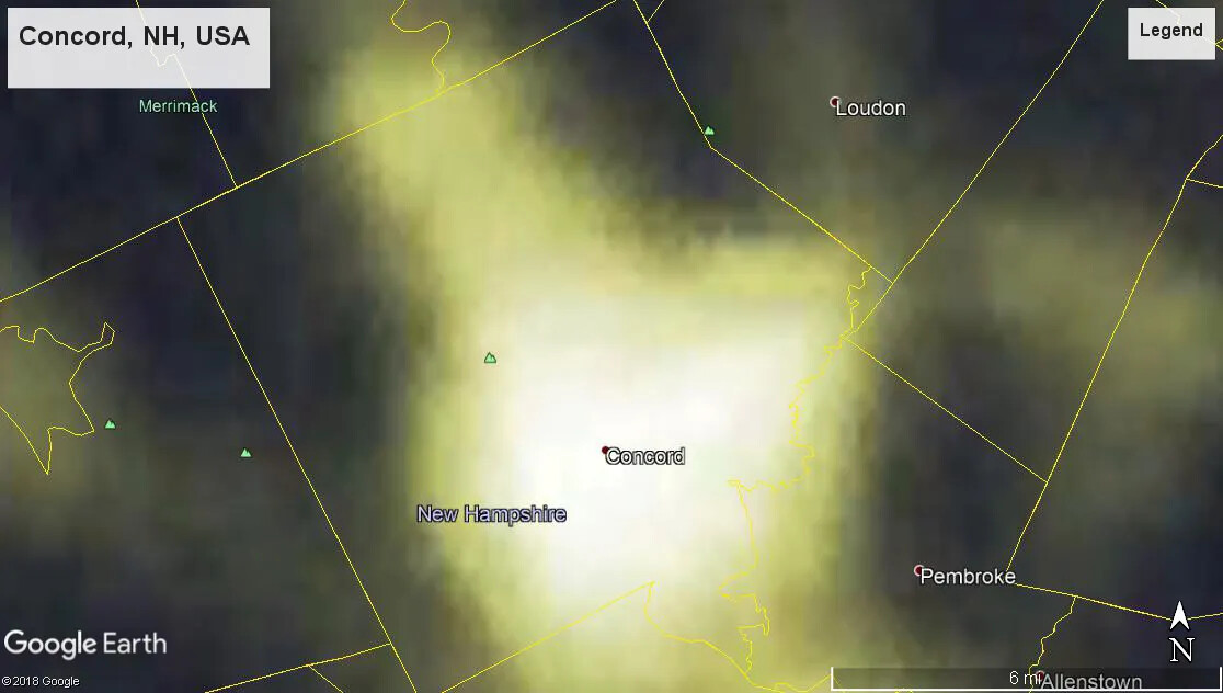 A colored screenshot of Concord, NH from Google Earth. This image shows the town boundaries, in yellow, of Concord, and parts of Loudon and Pembroke. The town boundaries of other towns, though nameless, are also showcased. Parts of Concord are colored a bright yellow, while the upper edges, as well as parts of Loudon and Pembroke, remain a greenish-black.