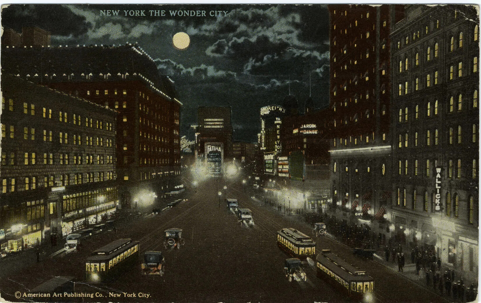 A colored postcard of a wide street lined with multi-storied buildings. The scene is depicted at night, with a full moon in a cloudy sky. All of the buildings have light shining through the windows, and the street is populated with cars and trolleys with their headlights on. Several people walk along the sidewalks. The title of the postcard, located along the upper border, reads "NEW YORK THE WONDER CITY."