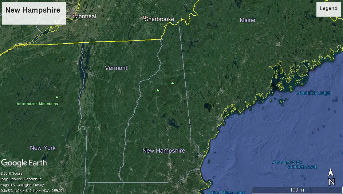 A colored close-up screenshot of Maine, New Hampshire, Vermont, and New York from Google Earth. The land masses are green and the Atlantic Ocean is blue. The Canadian border and the coast of Maine along the Atlantic Ocean are outlined in yellow.