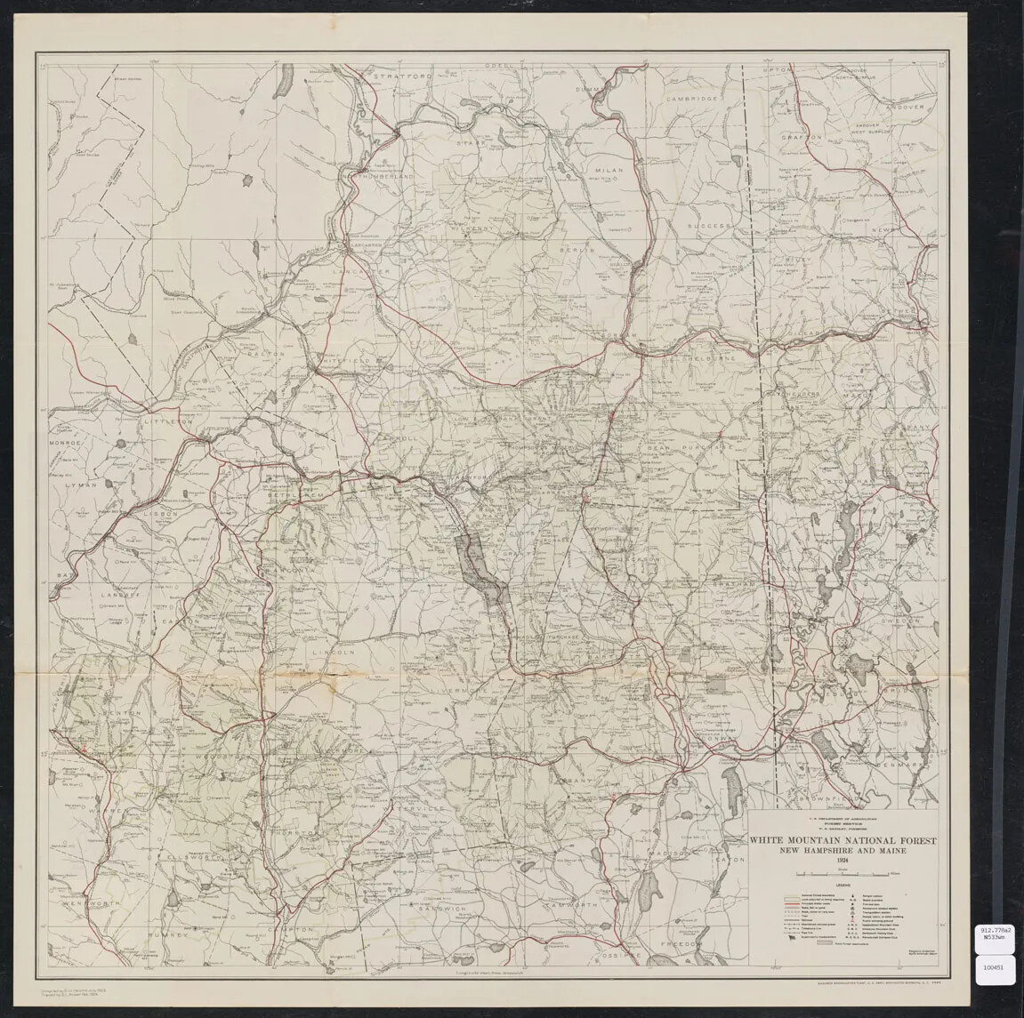 A large black and white square map is shown. It is dense with information, and includes markings for rivers, mountains, lakes, as well as town, county, and landmark notations. On the right is a black dotted border, with New Hampshire labeled to the left and Maine to the right. It is titled "WHITE MOUNTAIN NATIONAL FOREST NEW HAMPSHIRE AND MAINE 1924" in the lower righthand corner. A detailed key is below the title. 