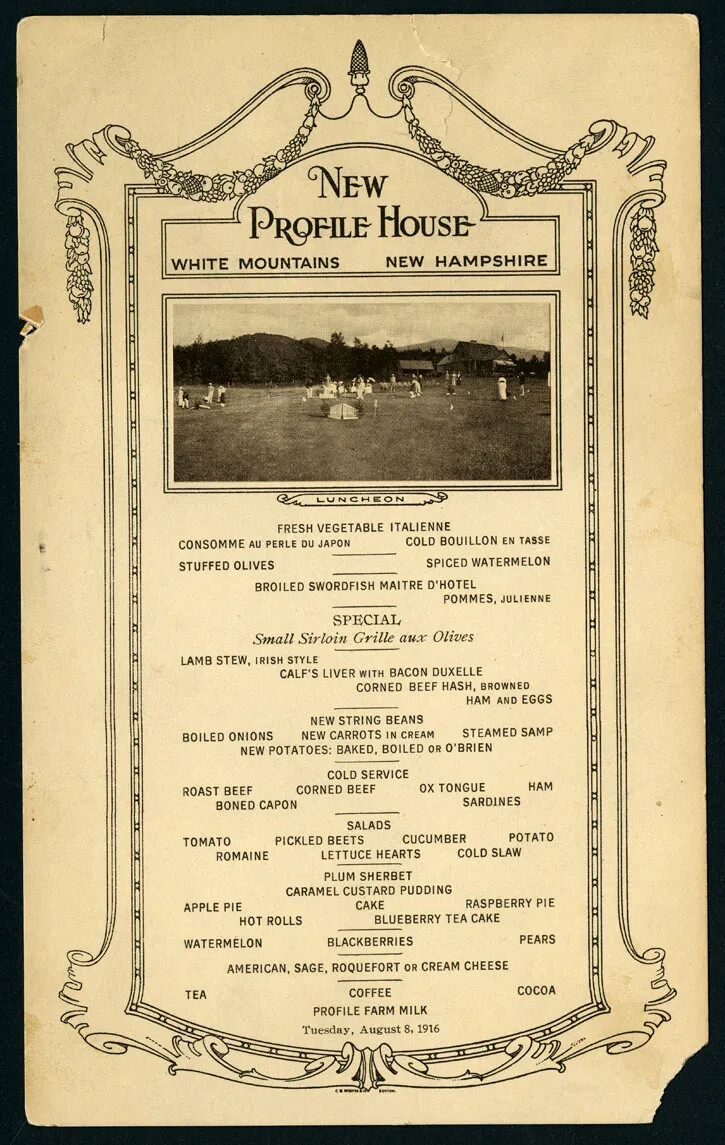 An old document of a list of items typed in black ink inside an decorated frame. There is a vine of fruit draped along the upper edge of the frame. The title of the document, centered along the top border, reads: "NEW/PROFILE HOUSE/WHITE MOUNTAINS NEW HAMPSHIRE." There is a black and white photograph placed just below the title. In the photograph, people gather in groups on a grassy field.
