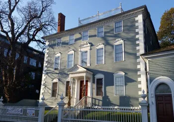 Historic Moffatt-Ladd House with light blue exterior and white trim.